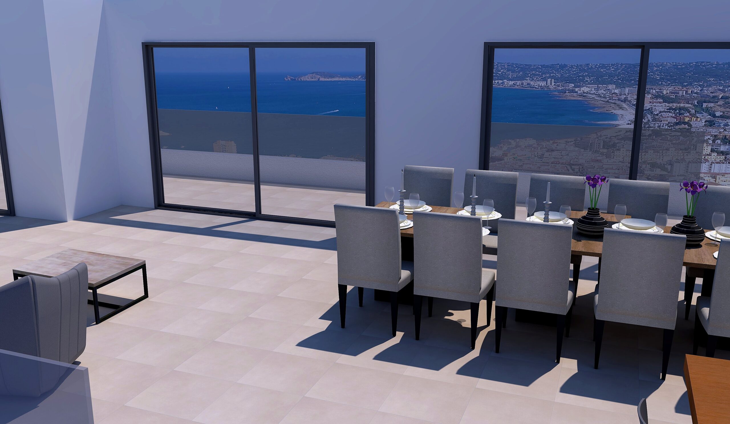 Salle à manger lumineuse avec grande table en bois et baies vitrées coulissantes offrant une vue panoramique sur la mer et la baie de Jávea.