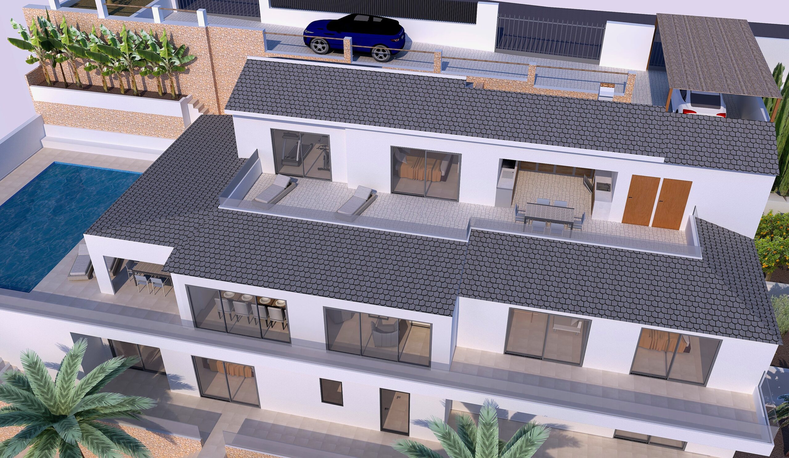 Vue aérienne de la villa rénovée illustrant son architecture en paliers, ses toits en tuiles grises, ses vastes terrasses vitrées et son espace piscine.