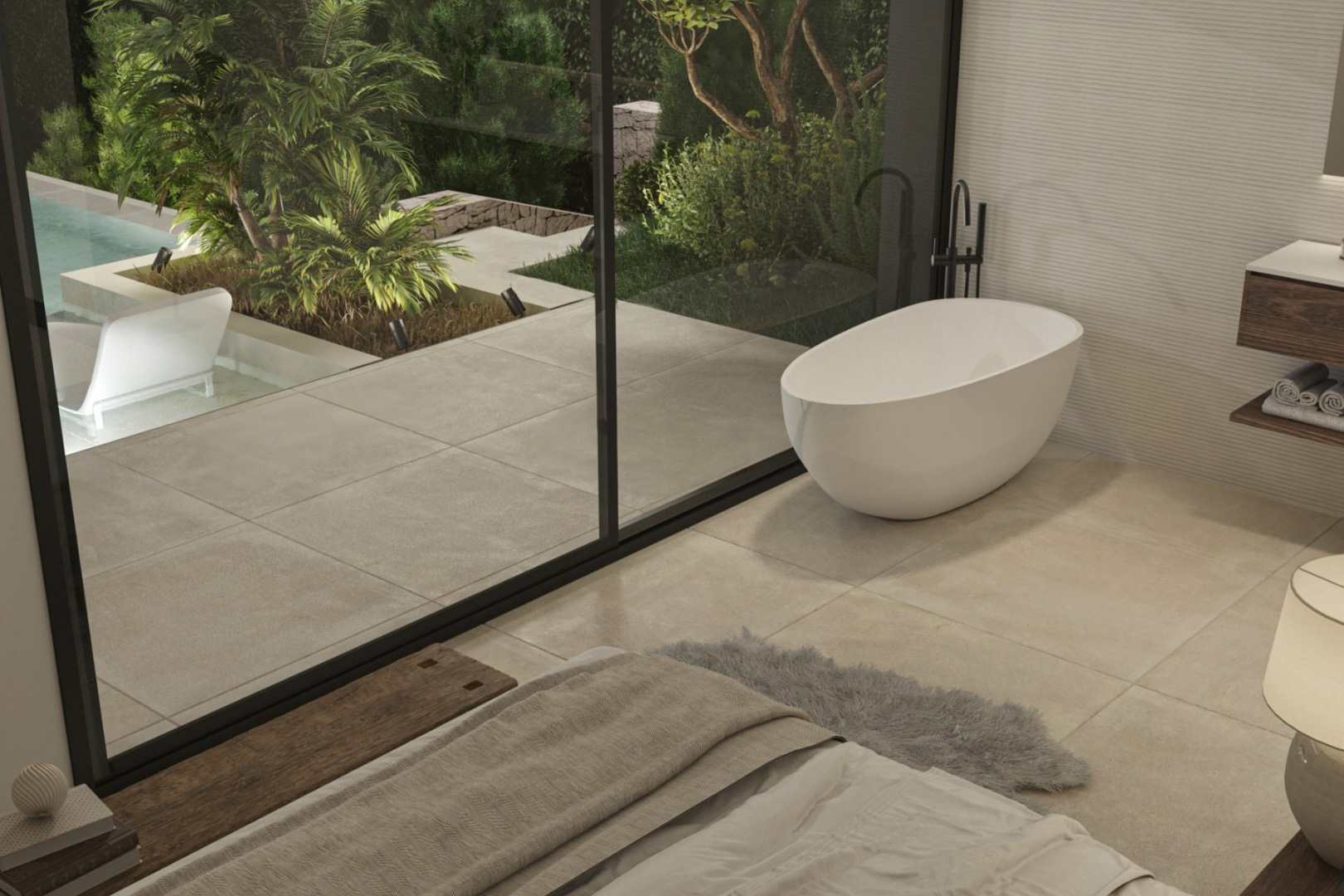 Suite parentale avec baignoire îlot design et grandes baies vitrées offrant un accès direct à la terrasse et au jardin paysager.