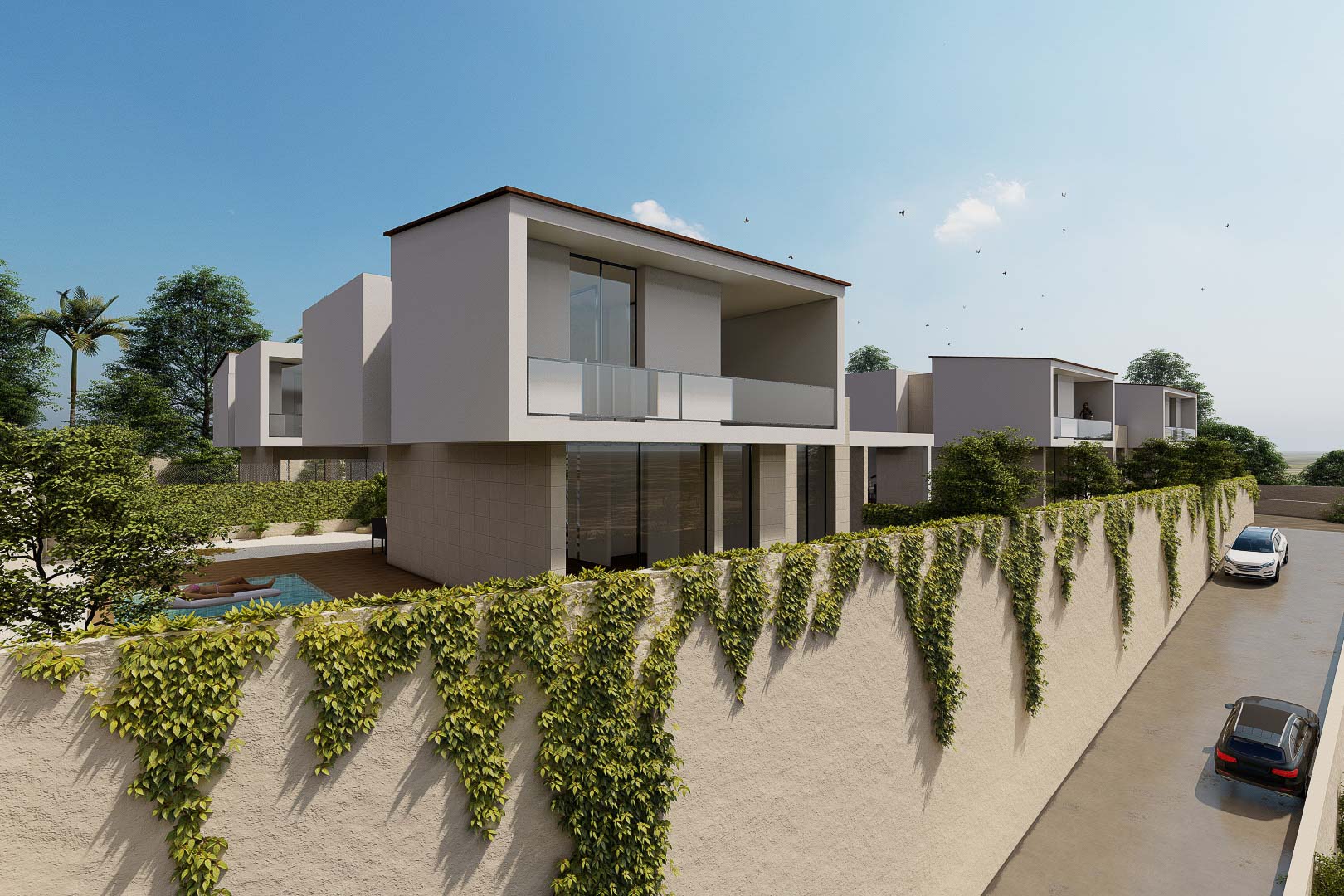 Vue extérieure de villas modernes avec balcons vitrés et murs d'enceinte recouverts de lierre. L'architecture se distingue par ses lignes épurées et ses volumes blancs contemporains.