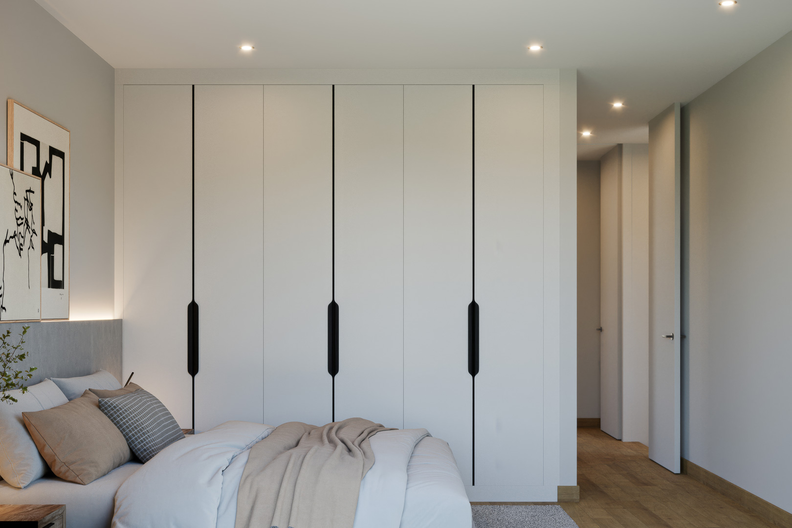 Chambre principale avec placards intégrés blancs aux poignées noires minimalistes, parquet en bois naturel et éclairage LED encastré au plafond.