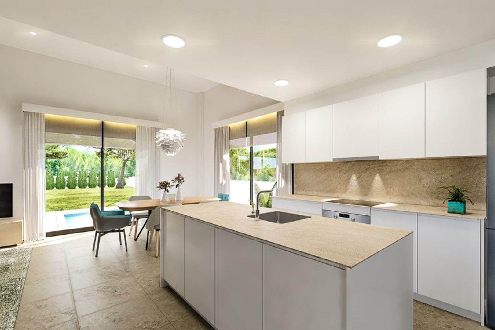 Cuisine moderne à aire ouverte avec îlot en pierre, meubles blancs minimalistes et salle à manger offrant une vue directe sur le jardin et la piscine.