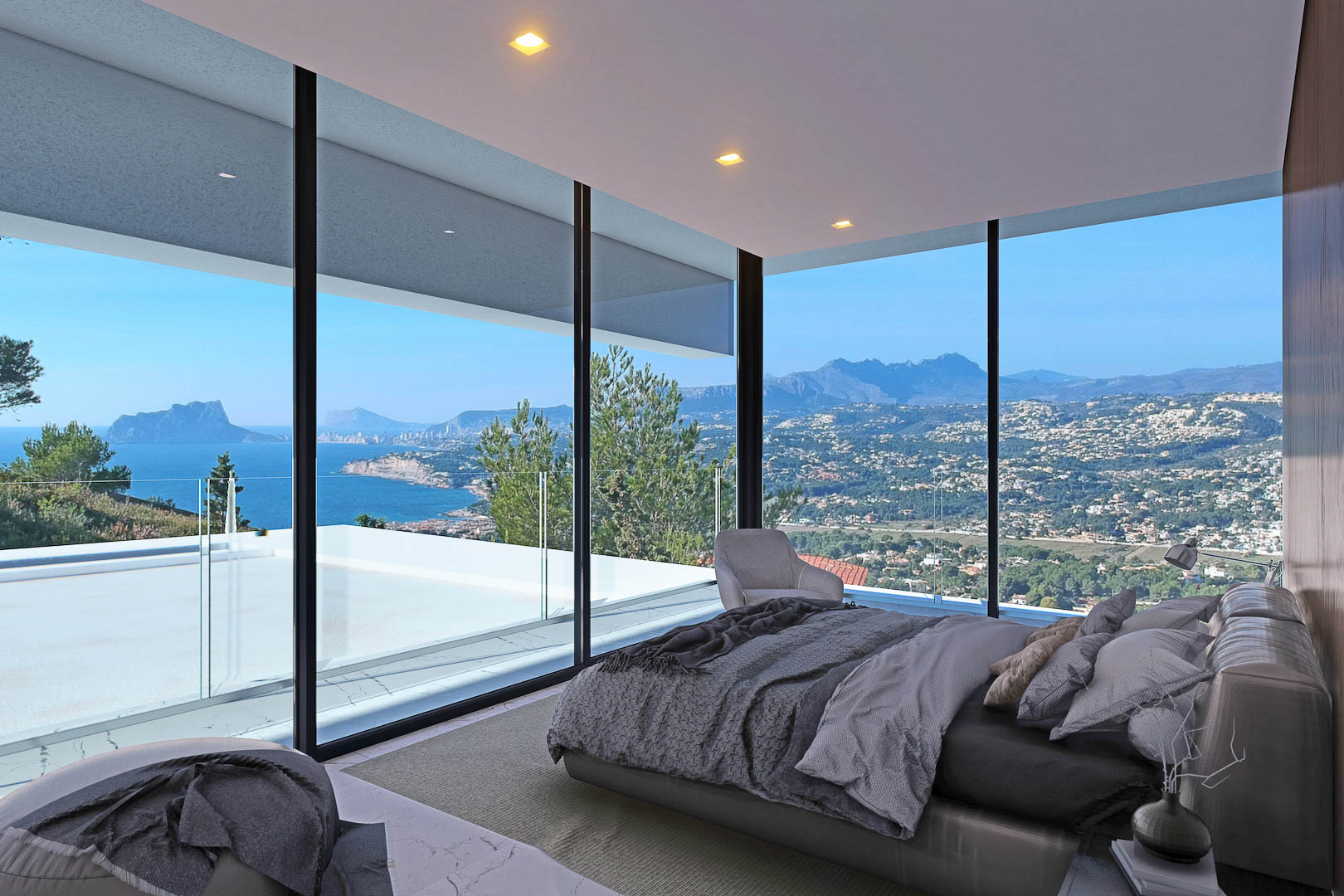 Chambre avec vue imprenable sur la mer et la côte, dotée de baies vitrées et de lumière naturelle.