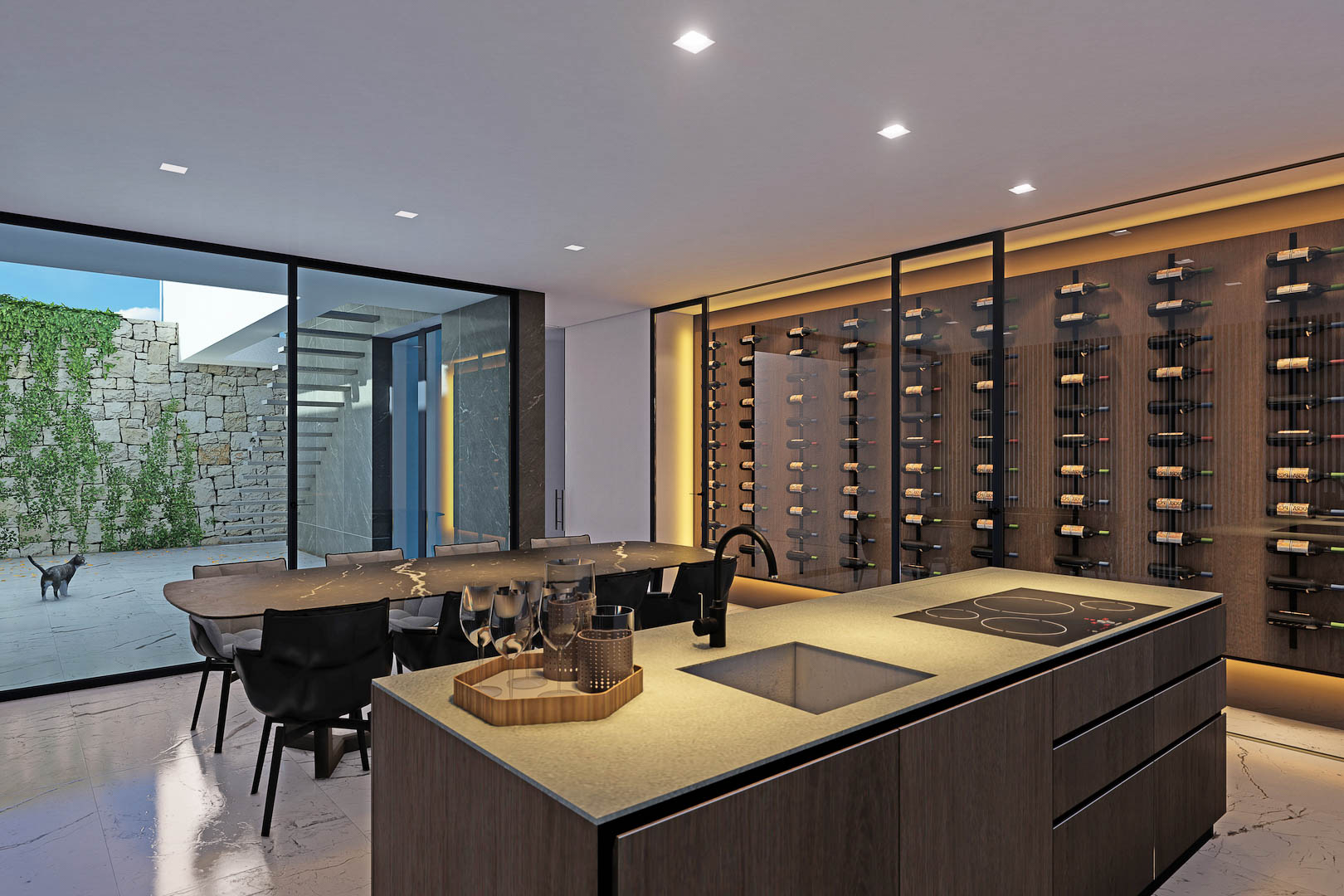 Détail de la cuisine avec îlot central, cave à vin vitrée et accès au patio extérieur.
