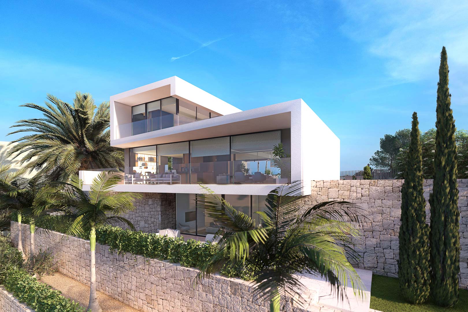Vue extérieure d'une villa moderne avec terrasses, murs en pierre et jardins tropicaux sous un ciel bleu clair.