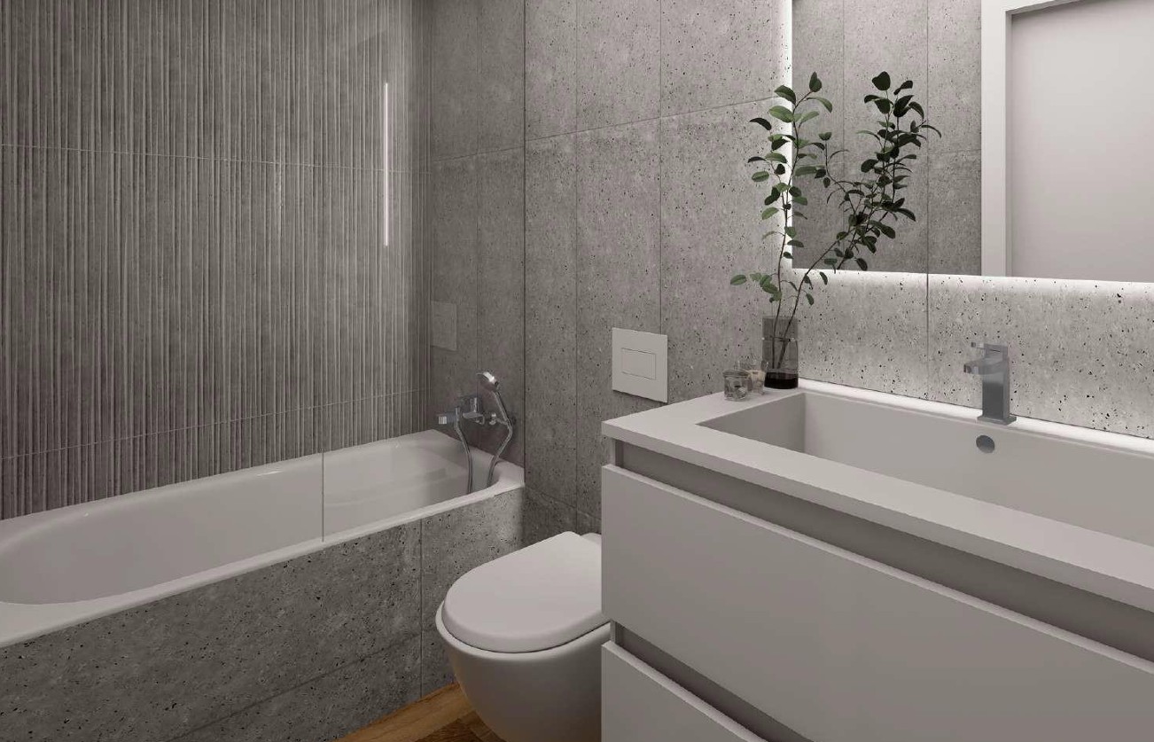 Salle de bains contemporaine avec carrelage Porcelanosa gris, baignoire intégrée, paroi en verre et meuble vasque moderne avec miroir rétroéclairé par LED.