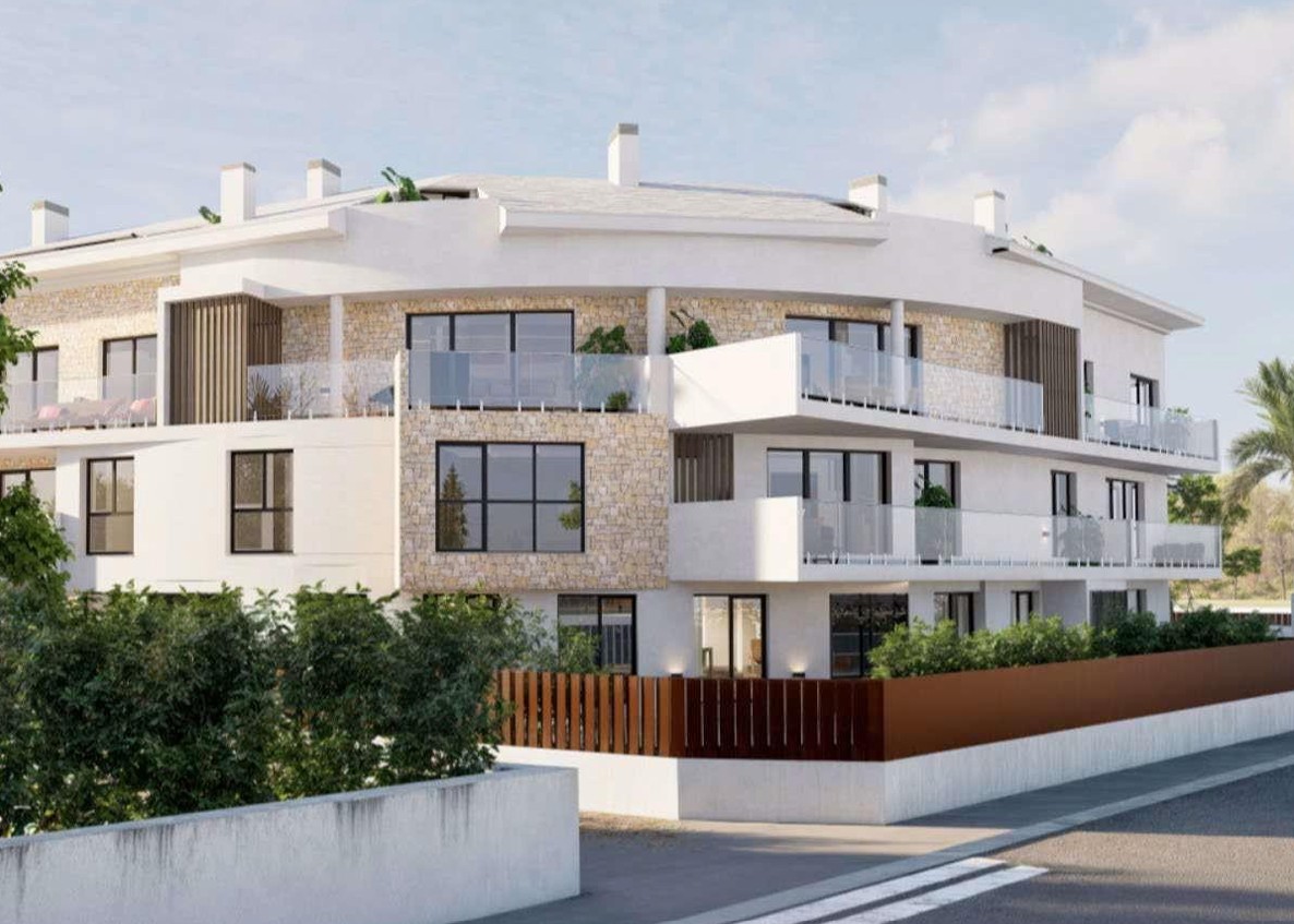 Vue extérieure du bâtiment résidentiel avec parement en pierre naturelle, terrasses à garde-corps en verre et menuiseries noires modernes.