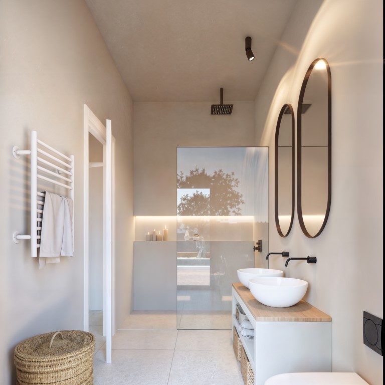 Salle de bains moderne avec double vasque sur plan en bois, robinetterie noire encastrée, miroirs ovales rétroéclairés et douche à l'italienne avec paroi vitrée.