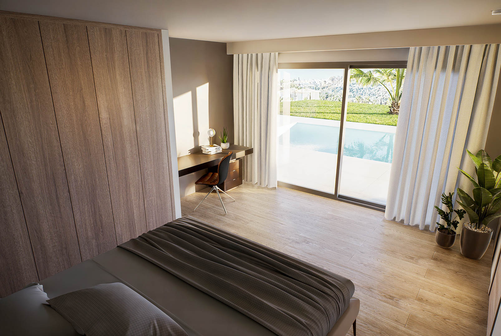 Chambre lumineuse avec placards intégrés en bois, coin bureau et accès direct à la piscine par de grandes baies vitrées. Sol en grès cérame aspect bois.