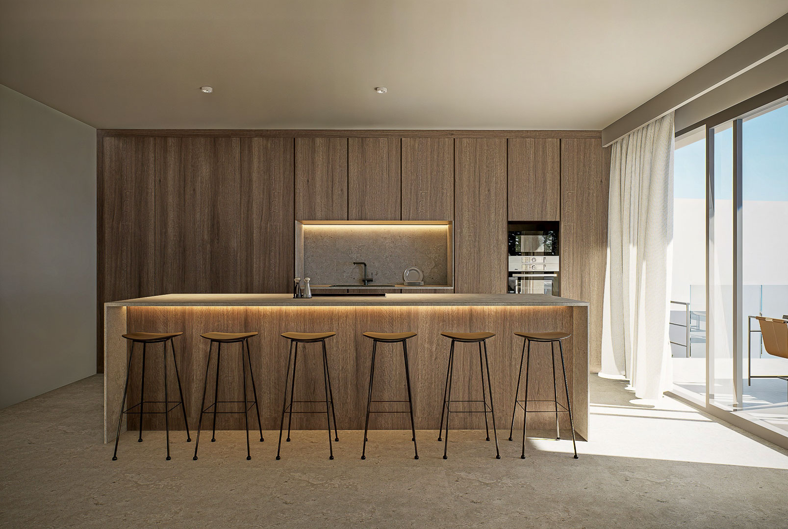 Cuisine de design avec îlot en pierre, tabourets minimalistes et menuiserie en bois toute hauteur intégrant un éclairage LED discret et un accès extérieur.