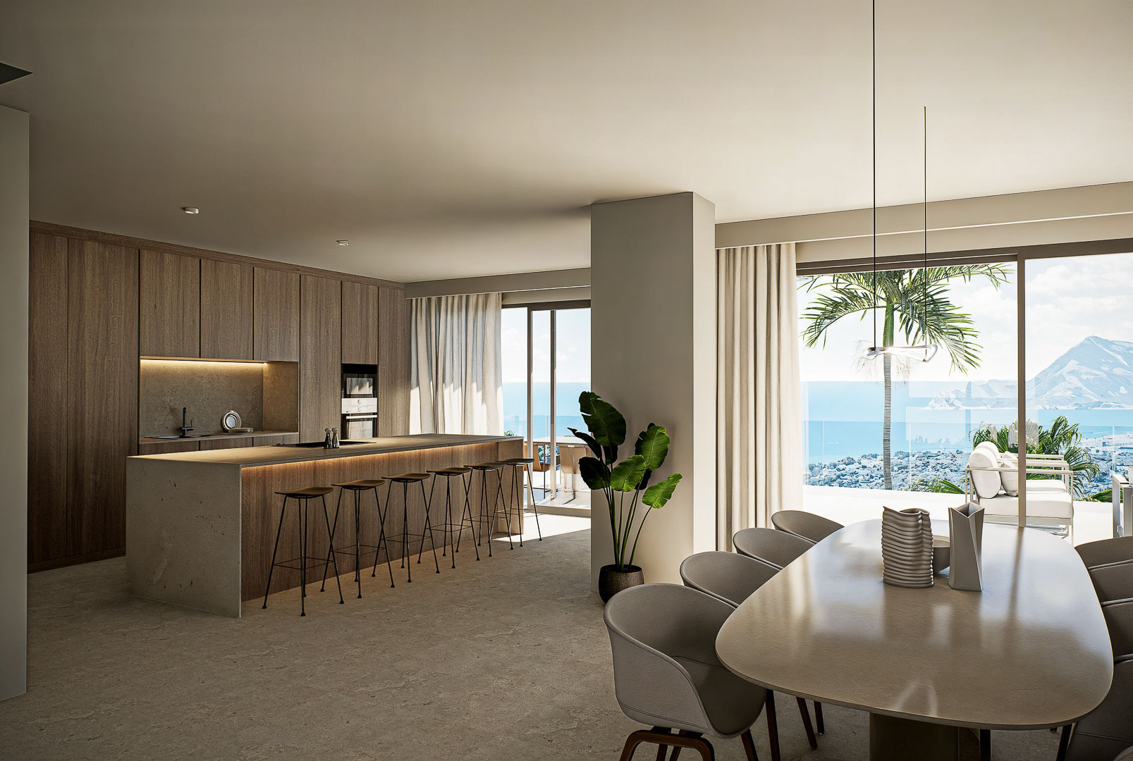 Cuisine de designer avec îlot en pierre et salle à manger intégrée, dotée de baies vitrées offrant une vue panoramique sur la mer Méditerranée.