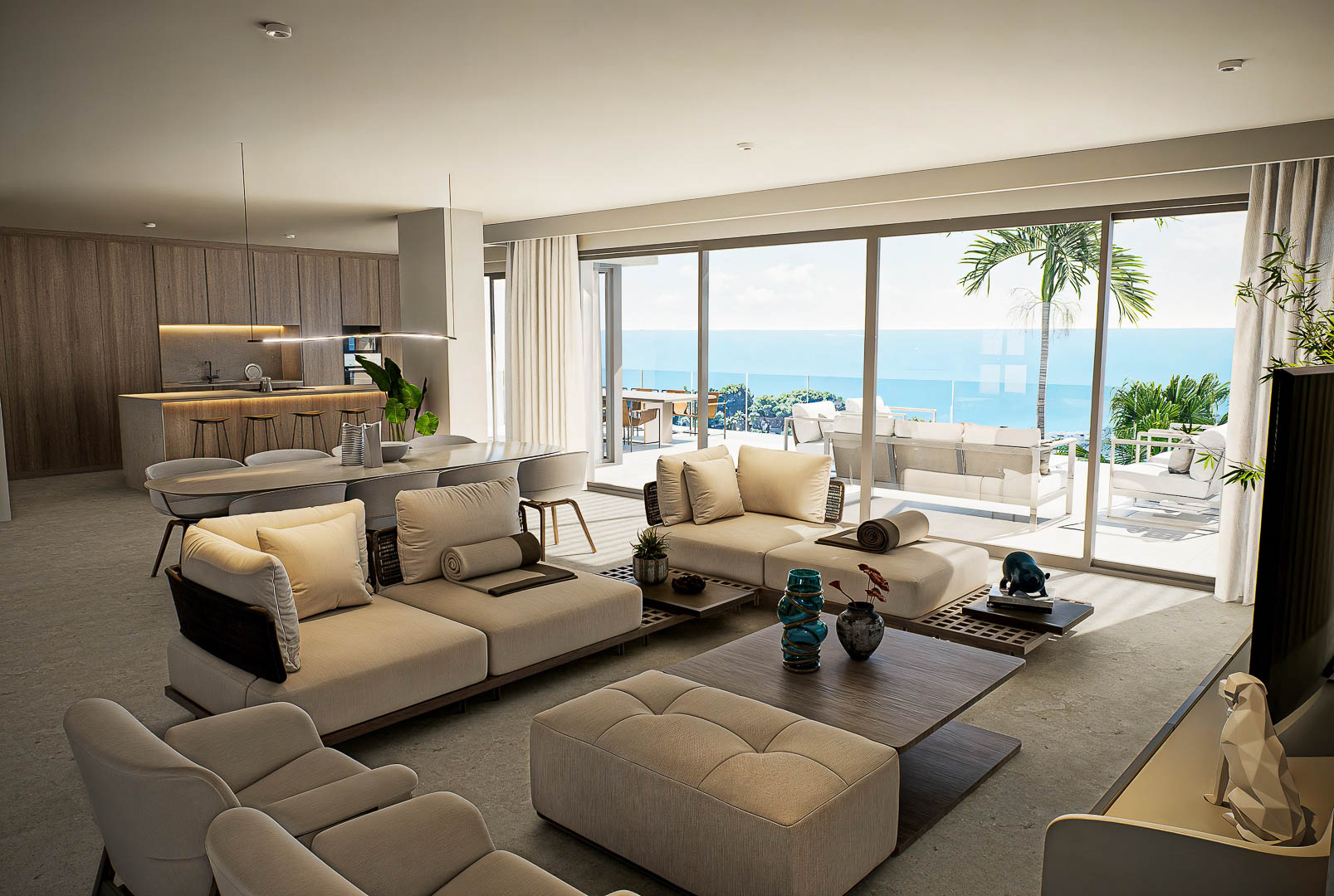 Espace de vie ouvert avec canapés modulables, cuisine en bois intégrée et baies vitrées offrant une vue dégagée sur la mer et la terrasse.