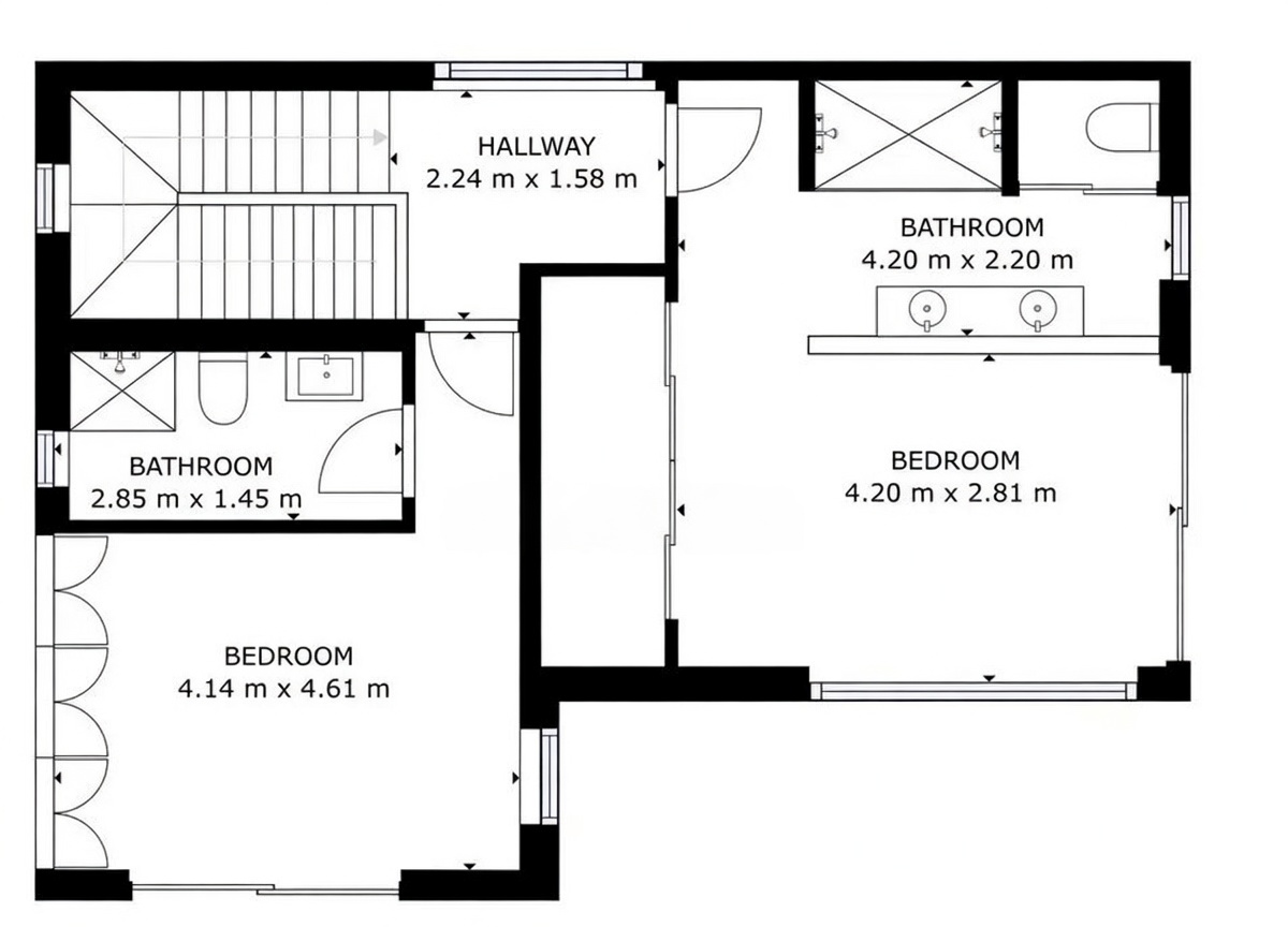 Plan d'étage détaillé présentant deux chambres, chacune avec salle de bain attenante, et un couloir central avec accès à l'escalier. Les dimensions de chaque pièce sont clairement indiquées.