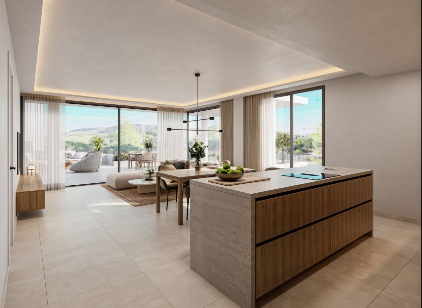 Espace de vie ouvert moderne avec îlot de cuisine en pierre et bois, salle à manger adjacente et salon lumineux. De grandes baies vitrées s'ouvrent sur une terrasse privée avec vue sur le paysage verdoyant.
