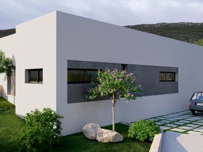 Extérieur de villa moderne avec façade blanche, panneaux texturés gris foncé et fenêtres horizontales. Jardin paysager avec arbre fleuri et allée pavée engazonnée.