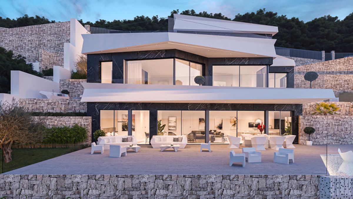 Villa contemporaine sur plusieurs niveaux avec parement en marbre sombre, surplombs blancs et grandes baies vitrées donnant sur une terrasse avec mobilier design.