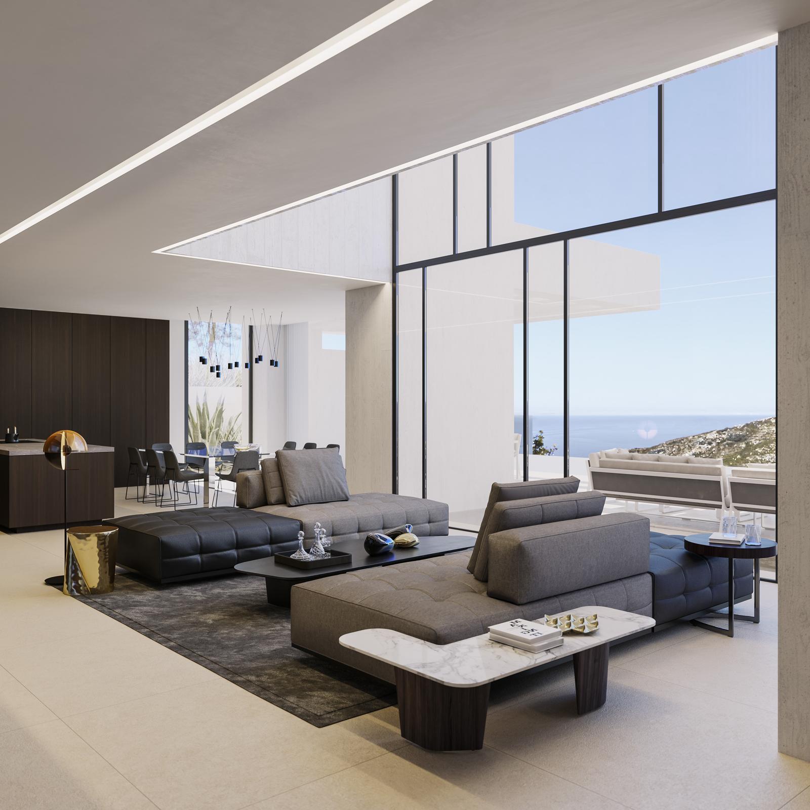 Salon ouvert moderne avec canapés modulables, plafonds à double hauteur et baies vitrées offrant une vue panoramique sur la mer et le littoral de Jávea.