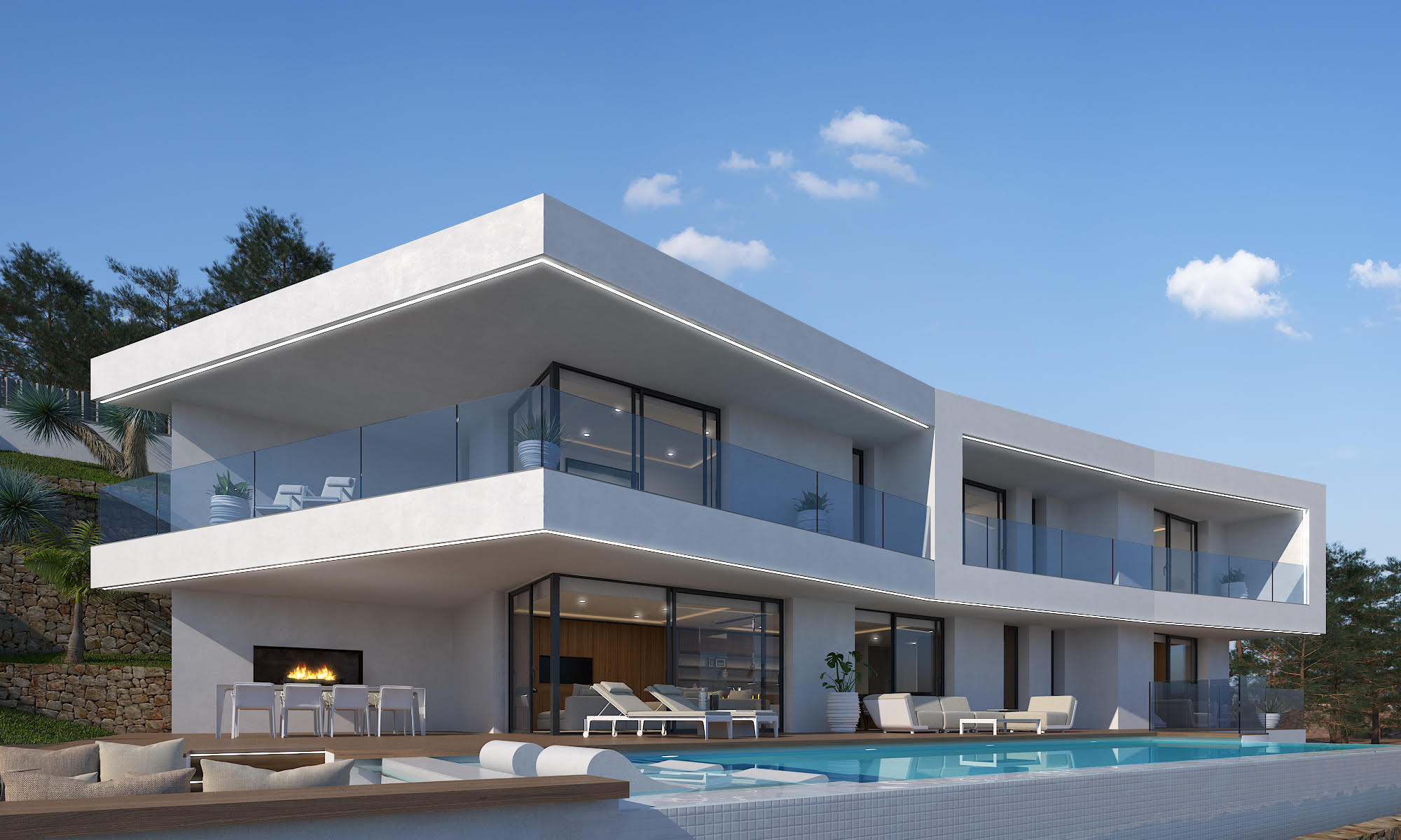 Vue extérieure de la villa avec piscine en mosaïque blanche et terrasse avec cheminée.