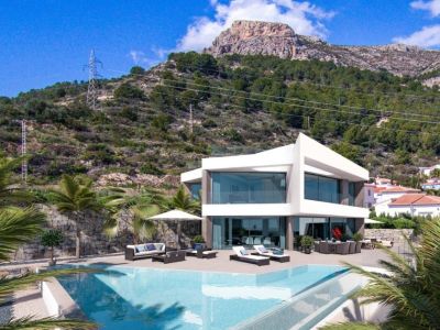 Vue extérieure de la villa avec piscine à débordement et coin salon, avec vue sur la montagne.