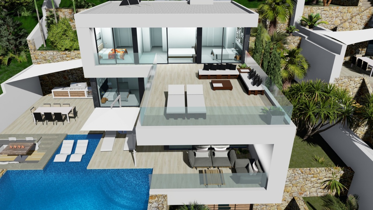 Vue aérienne de la villa avec piscine bleue, terrasse avec transats et espace de vie extérieur.