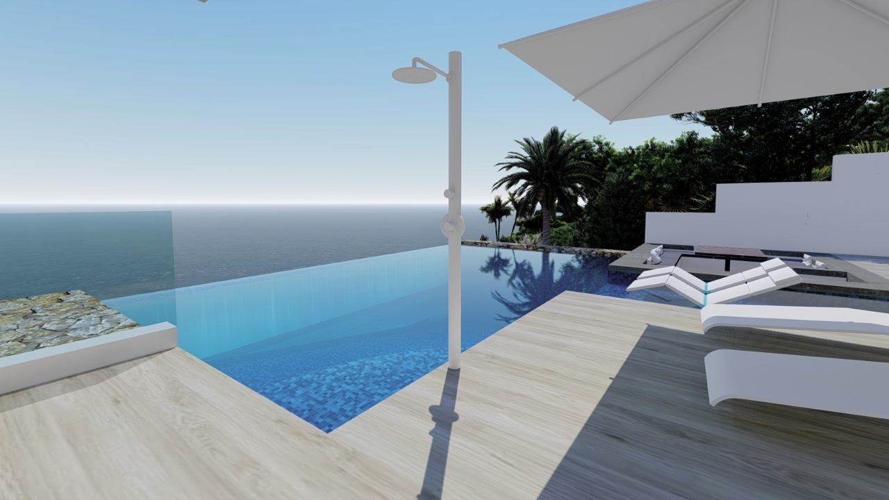 Vue sur la piscine à débordement avec douche et chaises longues blanches donnant sur la mer.