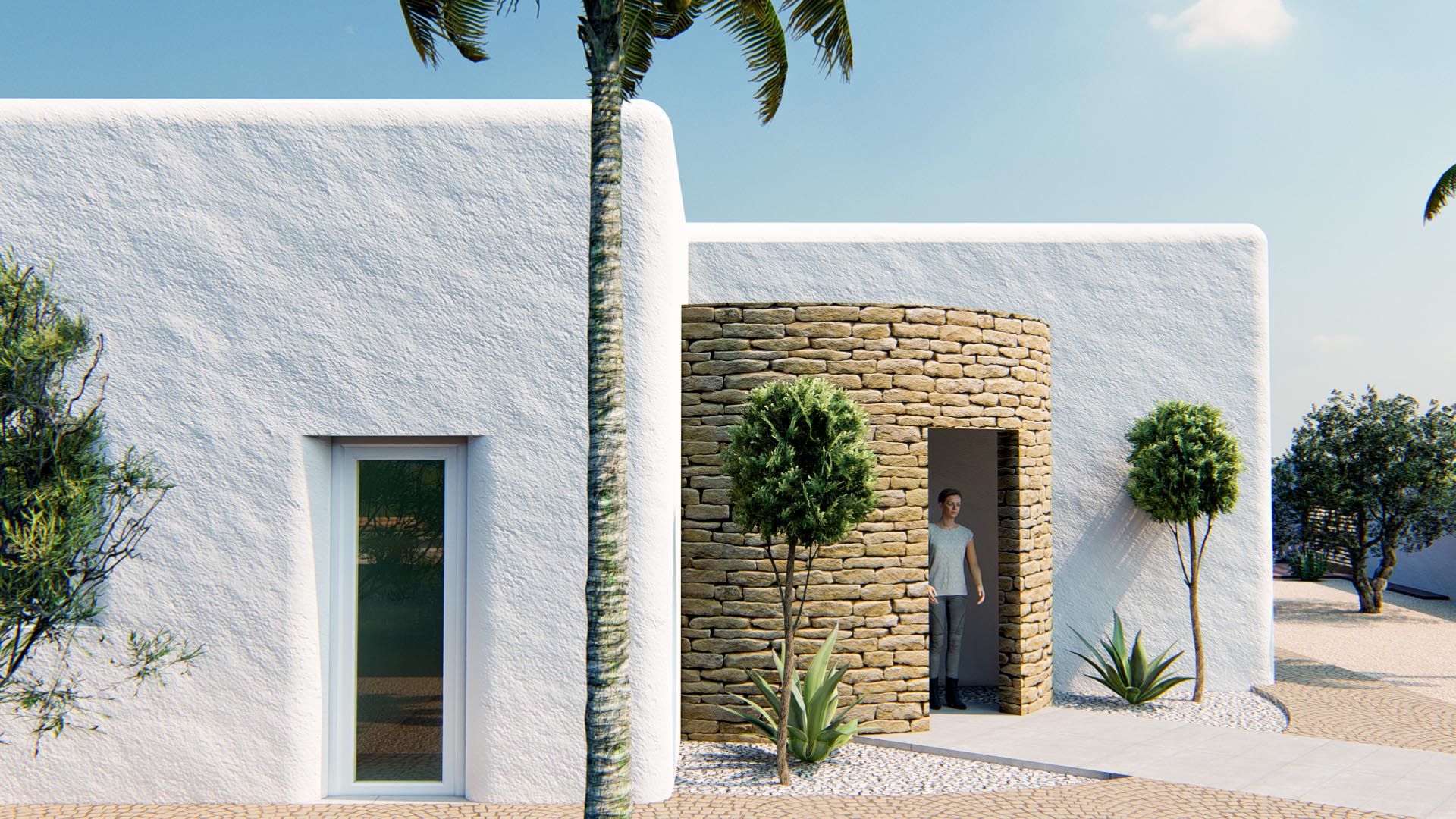 Façade de style ibizien avec murs en crépi blanc texturé et une entrée cylindrique en pierre naturelle, entourée d'un jardin méditerranéen soigné.