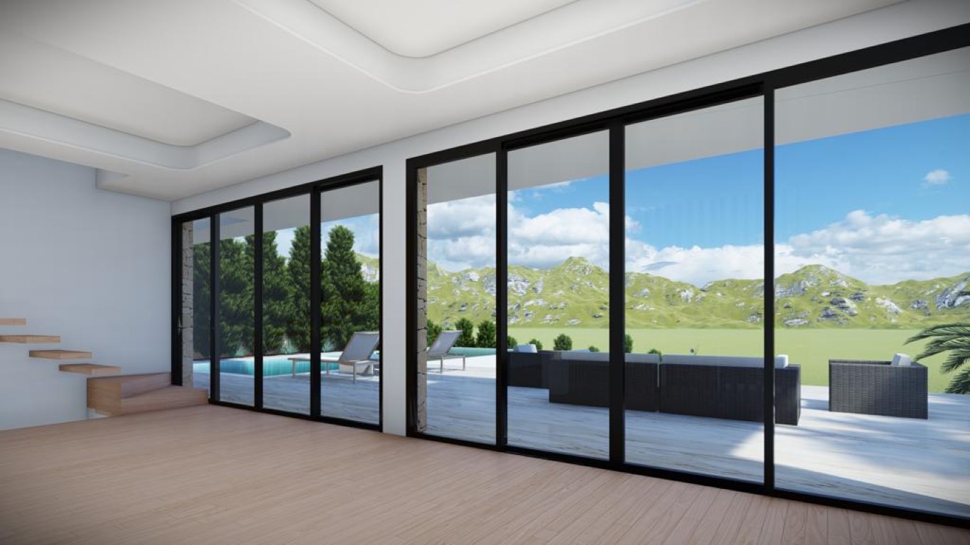 Salon spacieux avec parquet clair, plafonds à caissons et grandes baies vitrées offrant un accès direct à la terrasse, à la piscine et aux vues sur la montagne.