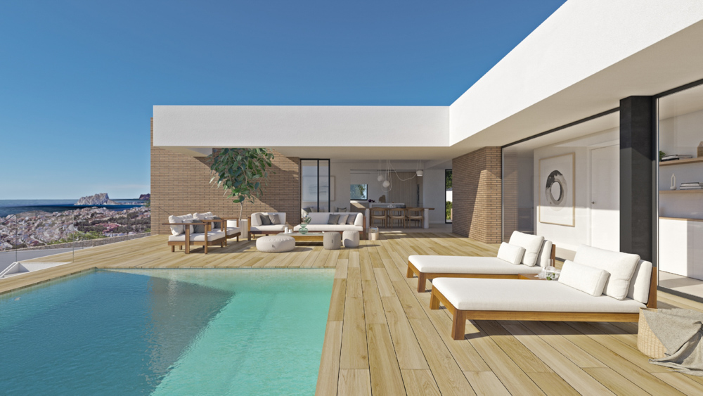 Terrasse principale avec revêtement en bois, piscine à débordement et mobilier extérieur offrant une vue panoramique sur la Méditerranée et le Peñón d'Ifach.