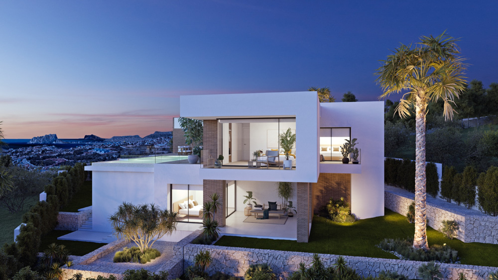 Vue extérieure de la villa au crépuscule, mettant en valeur l'architecture blanche, la piscine à débordement et les jardins en terrasses face à la mer.