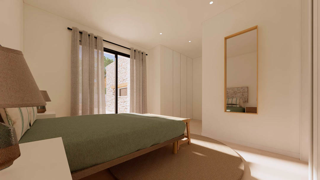 Chambre de style ibizane avec placards intégrés, mobilier en bois et baies vitrées s'ouvrant sur un extérieur aux murs en pierre naturelle apparente.