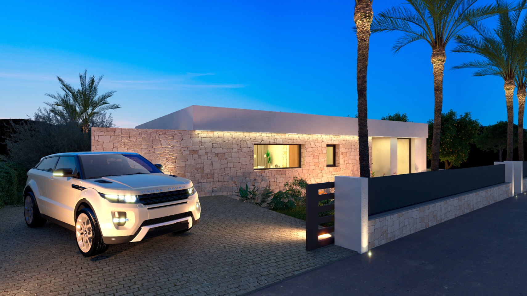 Vue extérieure de la villa avec façade en pierre illuminée et Range Rover dans l'allée.
