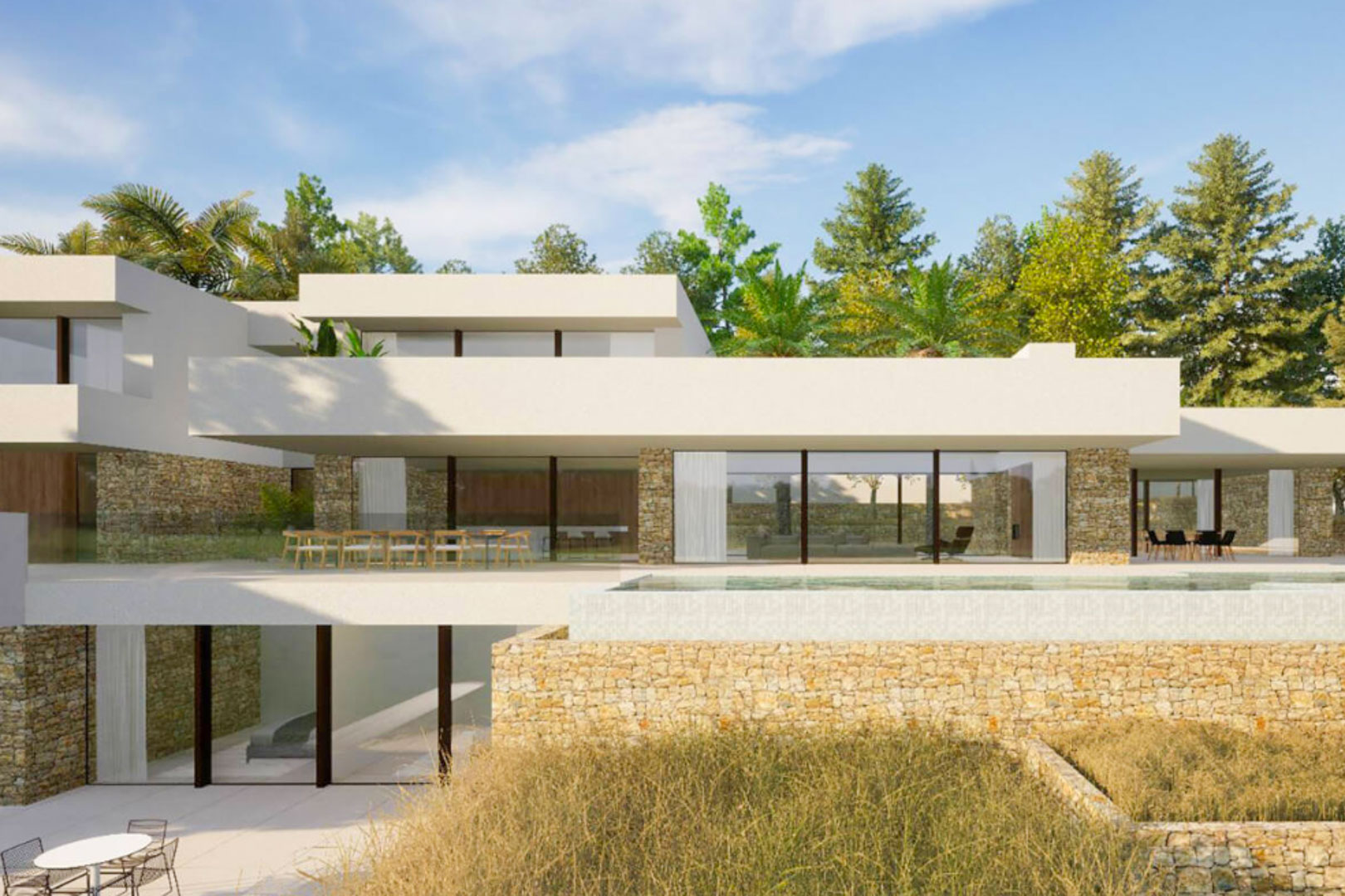 Villa moderne sur trois niveaux avec murs en pierre naturelle, grandes baies vitrées et une piscine à débordement intégrée à la terrasse principale.