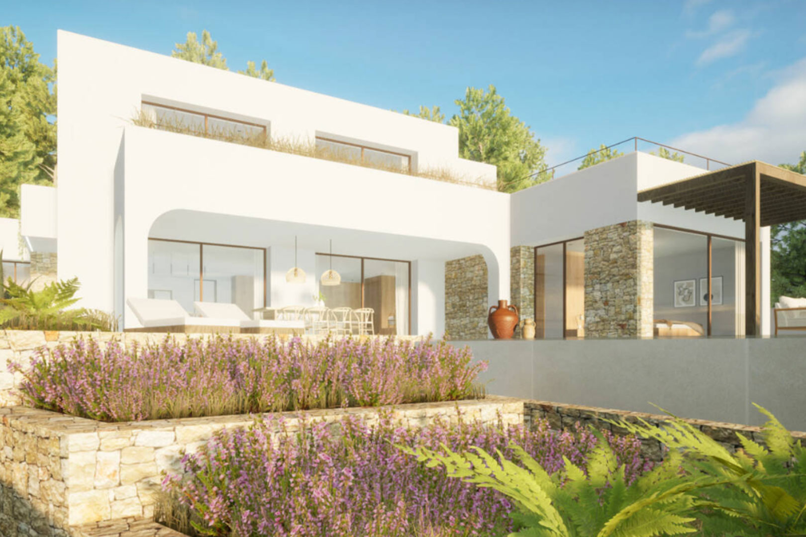 Vue extérieure de la villa avec jardin en terrasses et façade en pierre naturelle.