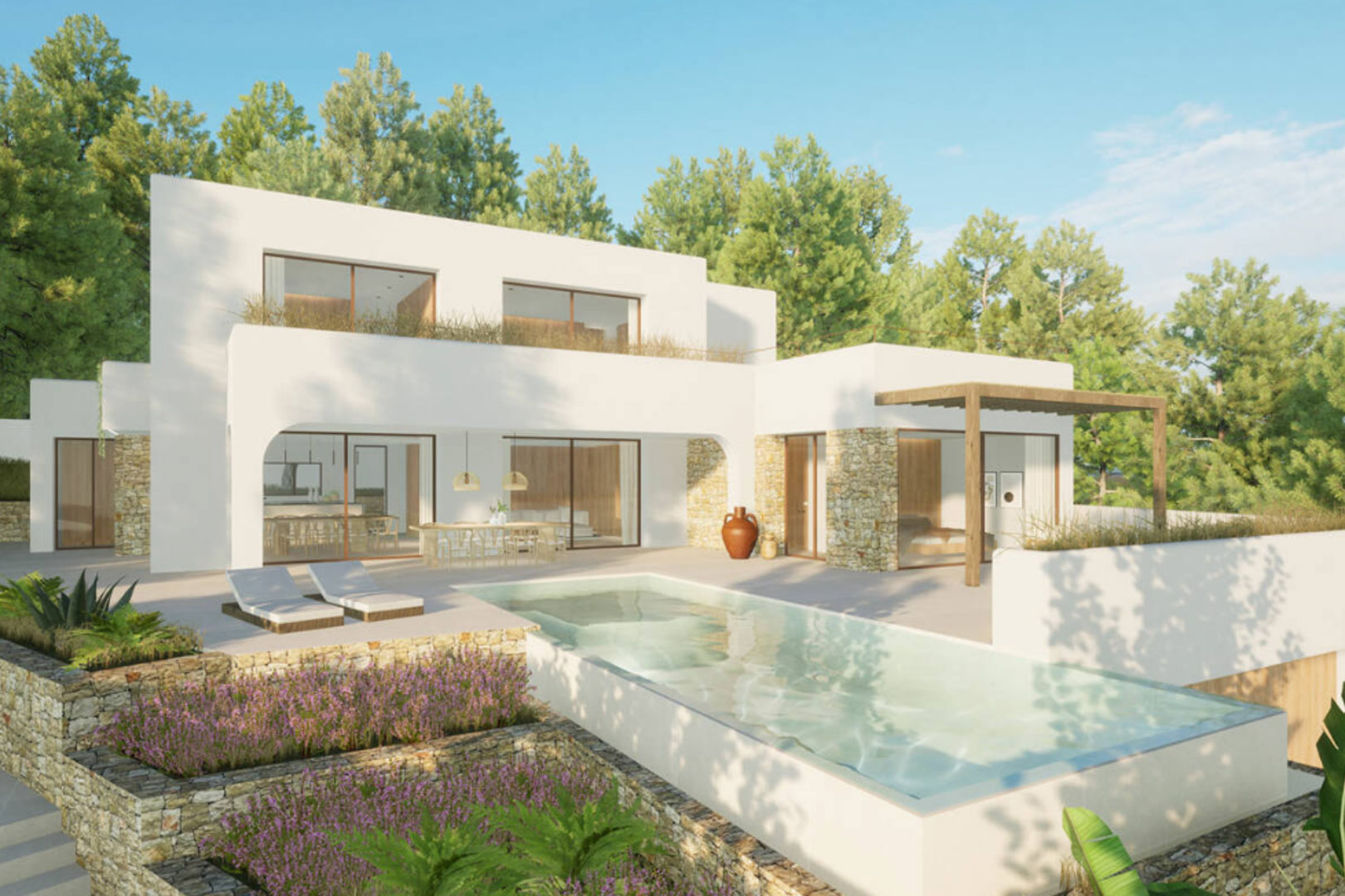 Vue extérieure de la villa avec piscine rectangulaire, terrasse avec chaises longues et jardin en murs de pierre.