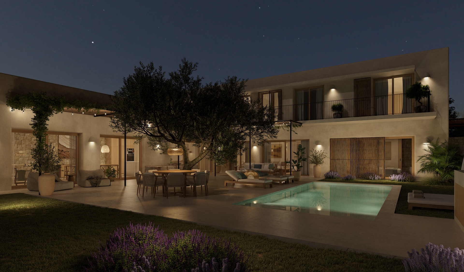 Vue nocturne de la cour avec piscine illuminée, salle à manger extérieure sous un arbre et façade de la villa avec balcons.