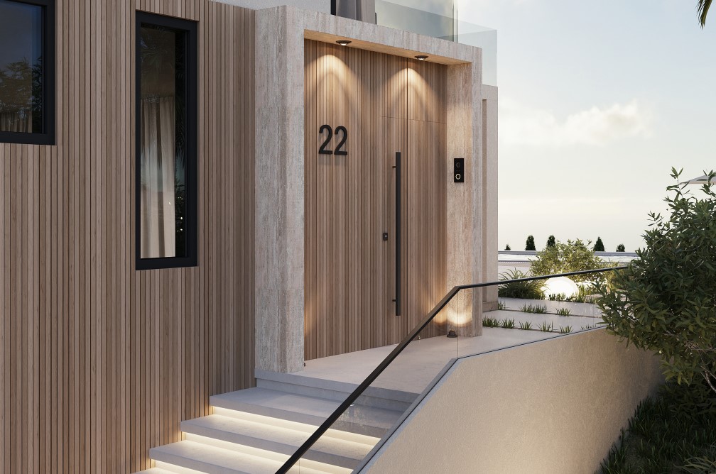 Entrée moderne avec porte en bois clair, numéro 22, et marches illuminées.