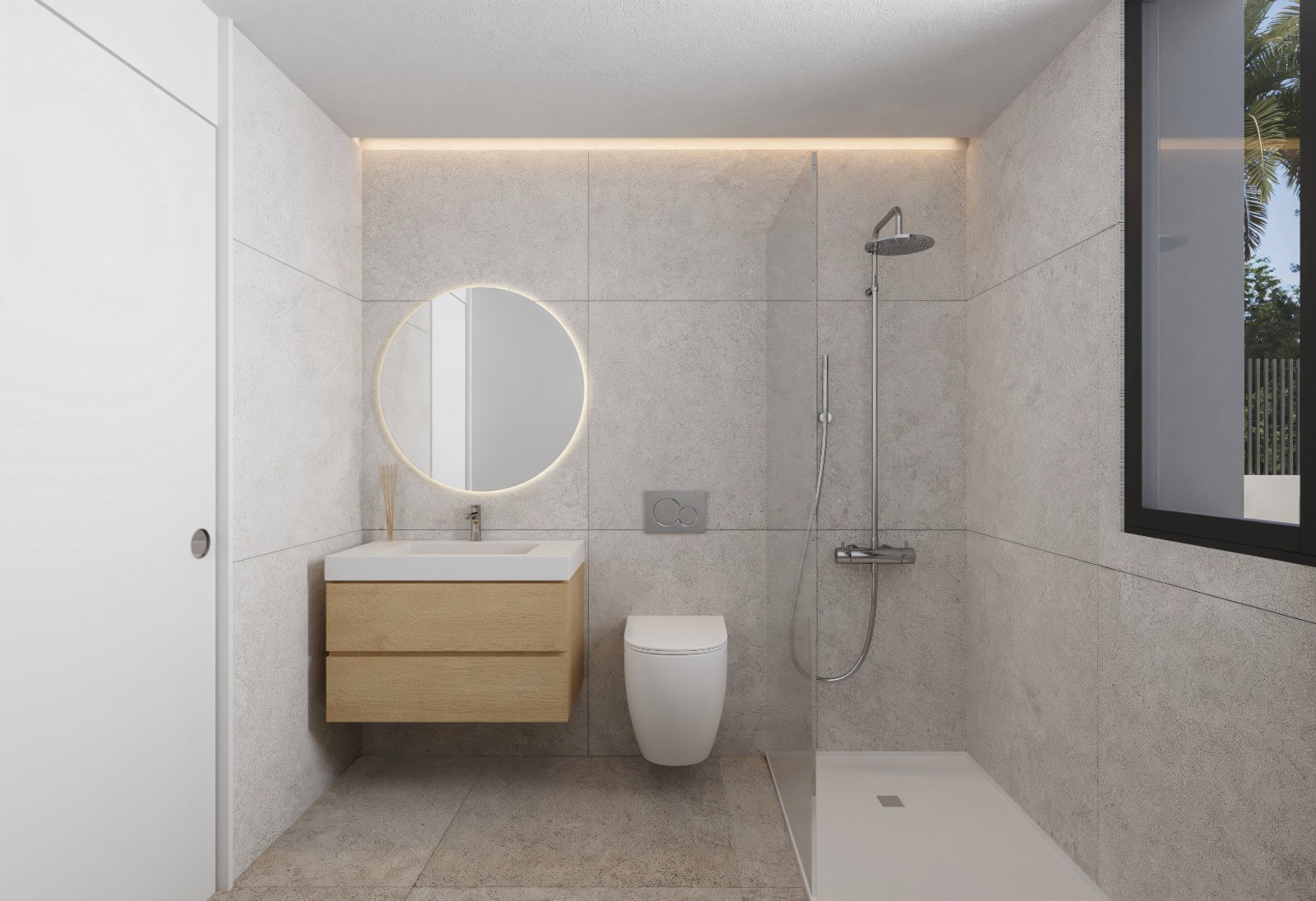 Salle de bain moderne avec carrelage gris grand format, meuble sous-vasque en bois clair, miroir circulaire rétroéclairé et douche à l'italienne avec paroi vitrée.