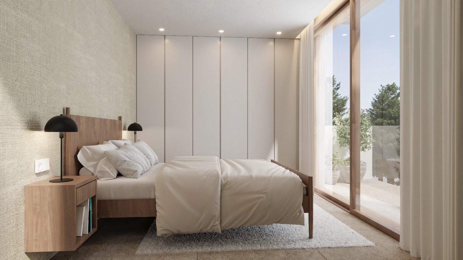 Chambre moderne avec placards intégrés toute hauteur, lit en bois et grandes baies vitrées coulissantes ouvrant sur une terrasse privée.