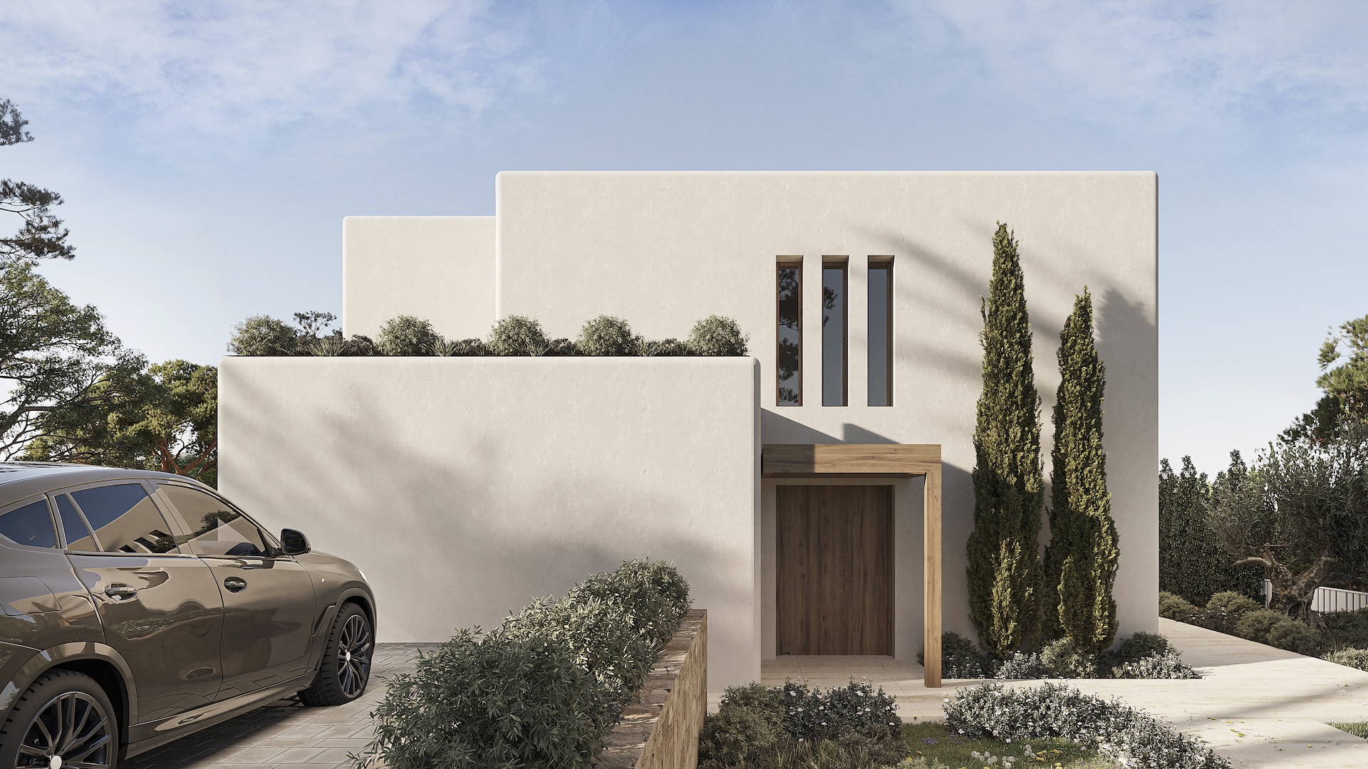 Façade principale de style ibizien avec murs blancs texturés, porte d'entrée en bois sous linteau et fenêtres verticales. L'accès comprend un pavage en pierre et des cyprès décoratifs.