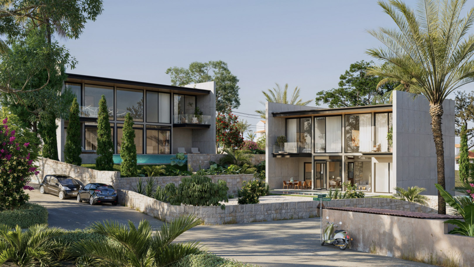 Vue extérieure des villas modernes avec façades en béton, grandes baies vitrées et jardins paysagers entourés de murs en pierre naturelle.
