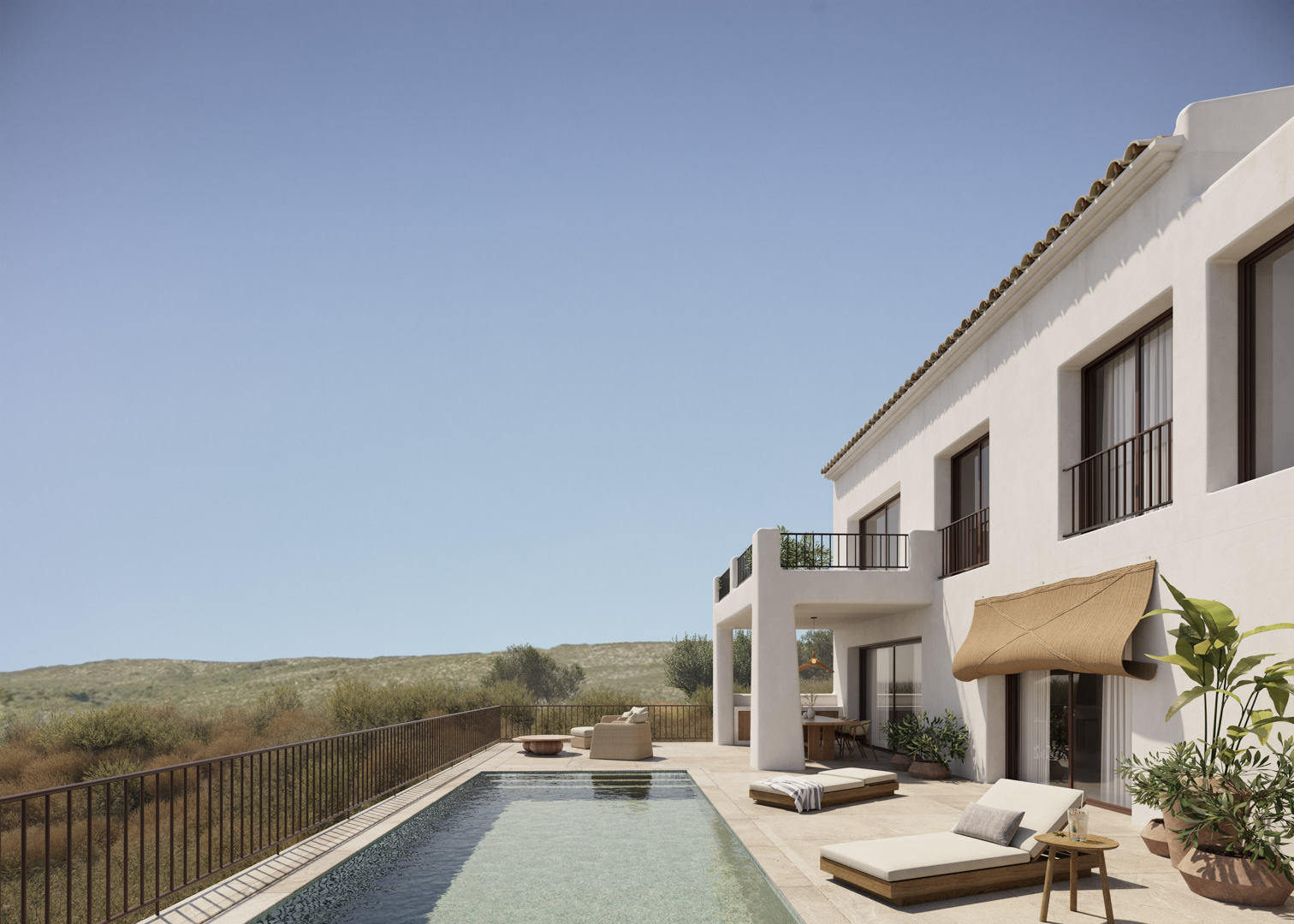 Façade blanche de style ibizien avec piscine rectangulaire, terrasse en pierre naturelle et espaces de détente extérieurs offrant une vue sur la vallée.