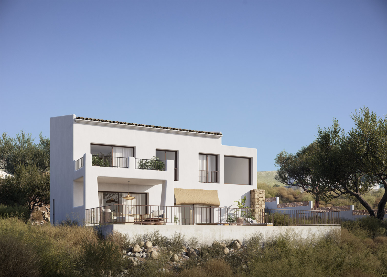 Vue extérieure de la villa de style ibizien avec façades blanches, grandes baies vitrées et terrasses sur deux niveaux intégrées au paysage naturel.