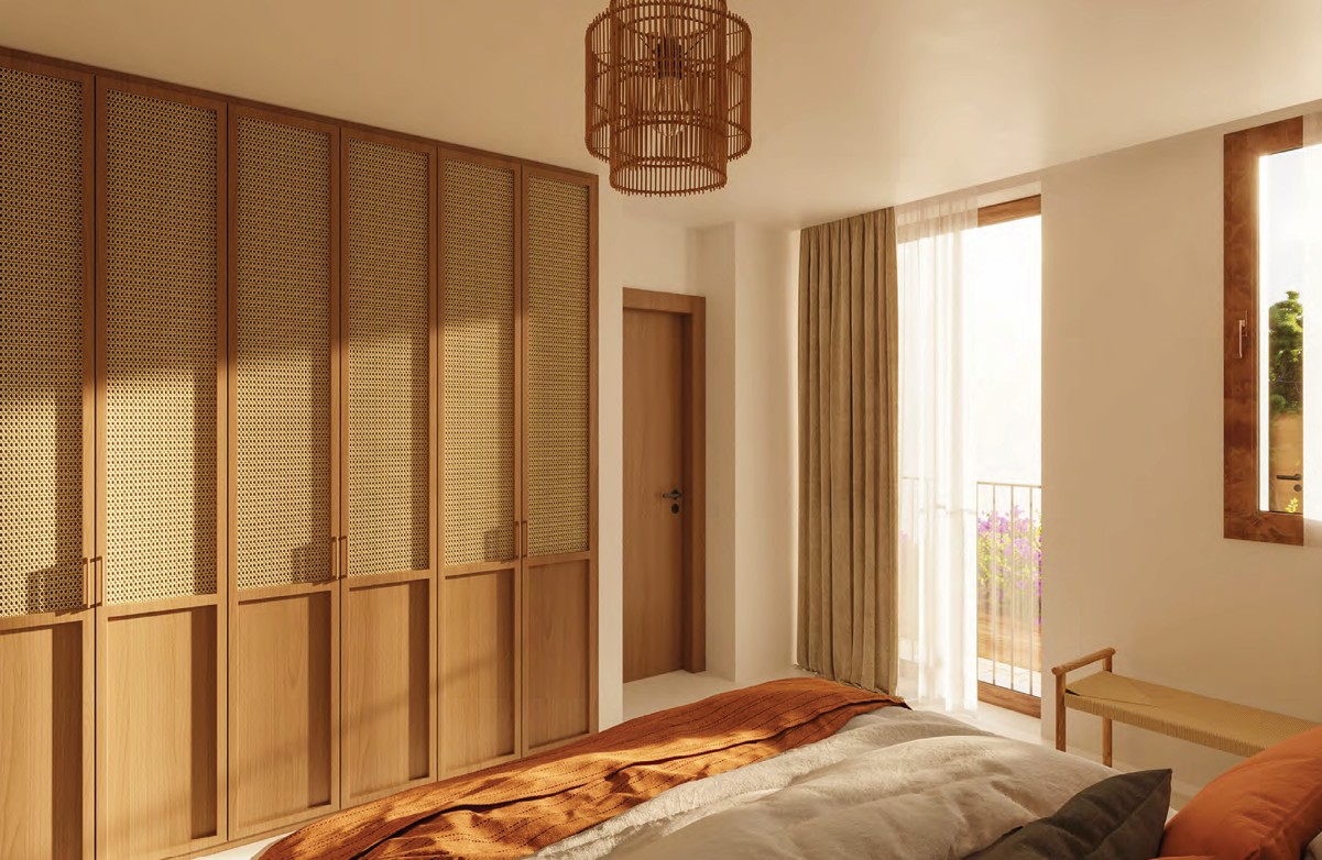 Chambre avec armoire en bois et suspension en osier.