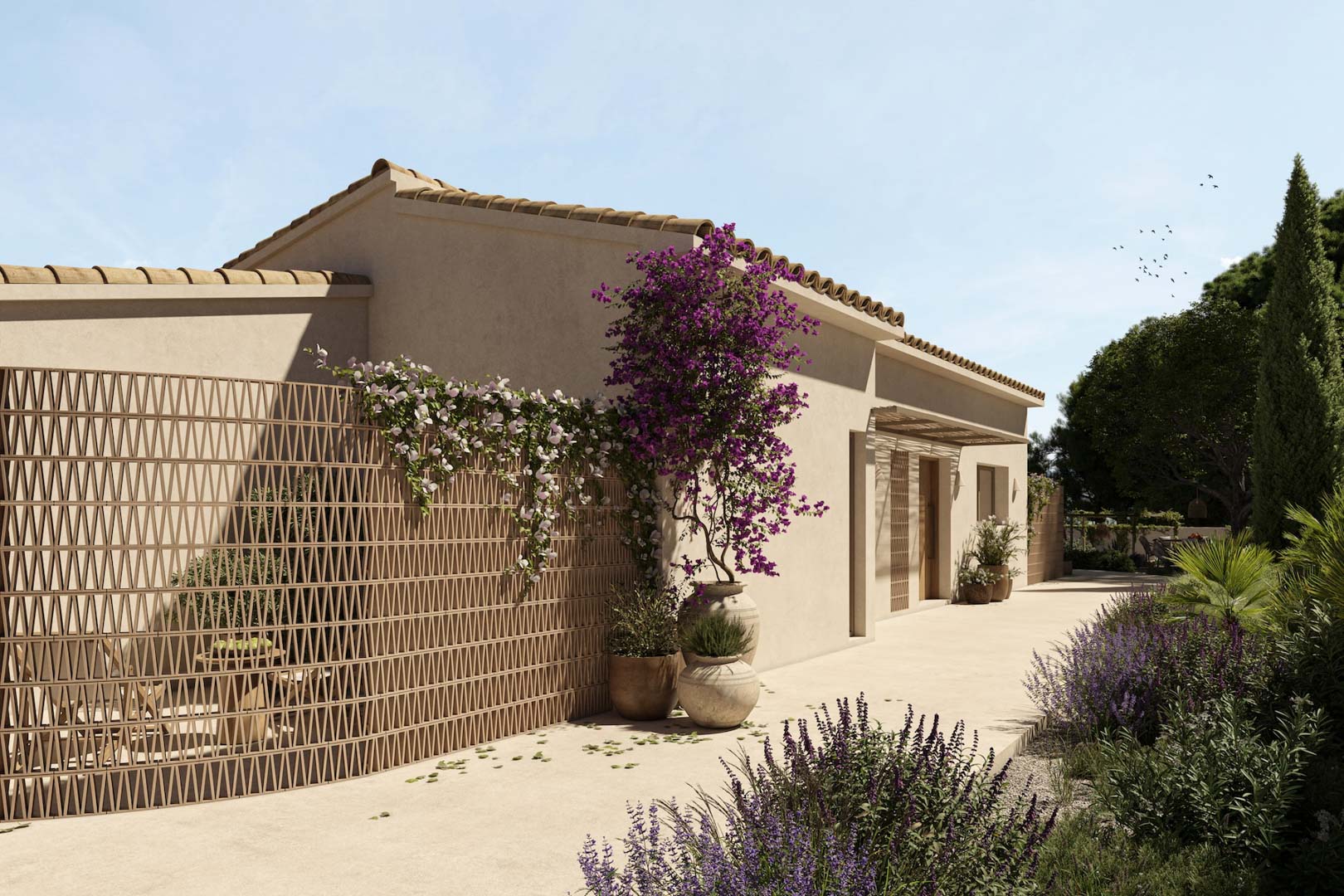 Façade méditerranéenne avec claustra décoratif, bougainvilliers en pots de terre cuite et chemin pavé bordé de végétation locale et de lavande.