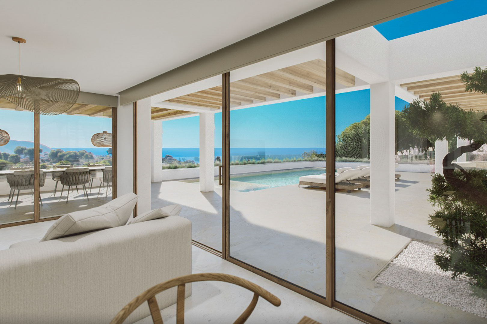 Salon moderne avec vue sur la piscine et la mer, accès direct à la terrasse extérieure.