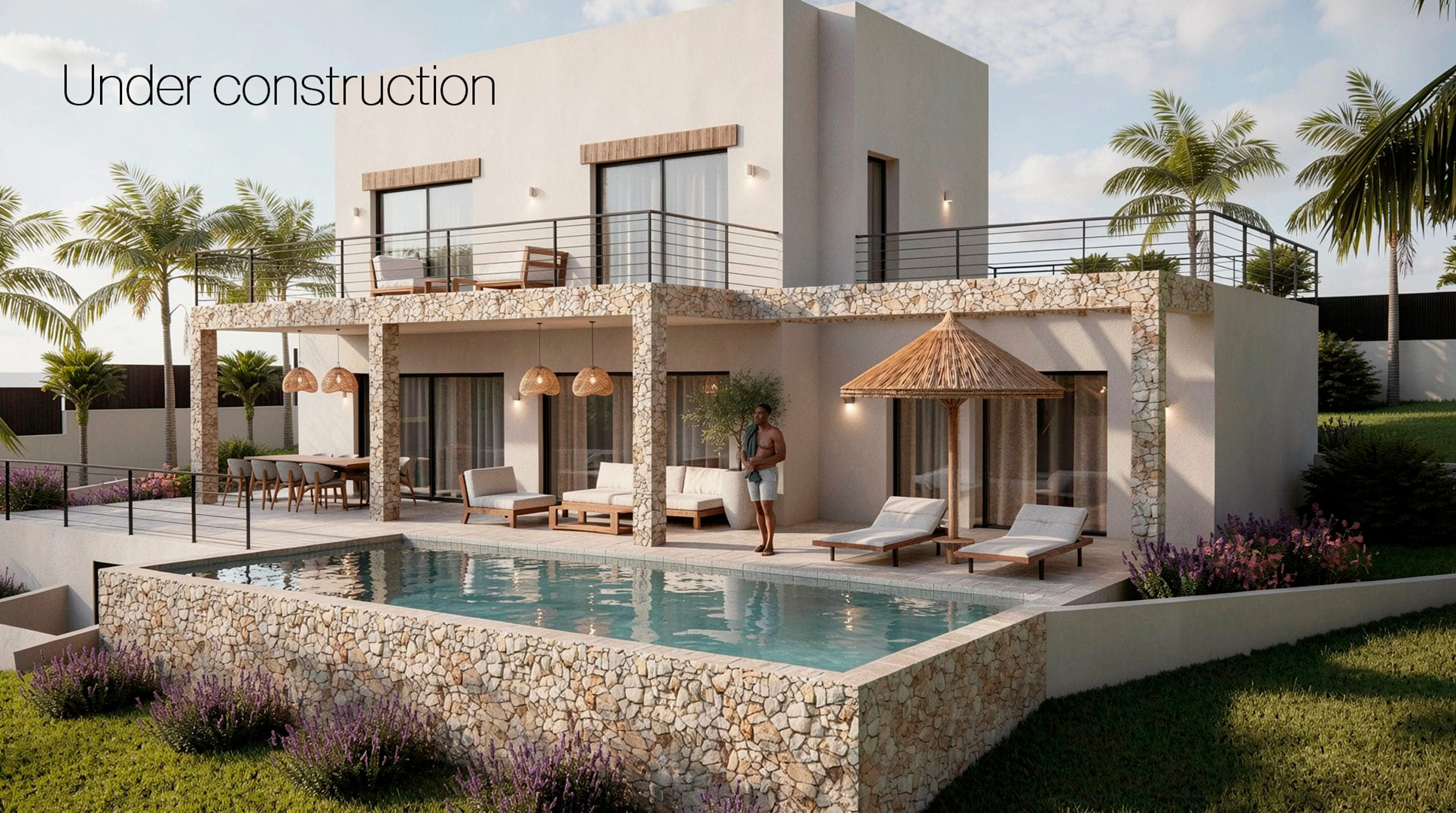 Vue extérieure de la villa moderne avec piscine privée, murs en pierre naturelle, vastes terrasses couvertes et architecture contemporaine blanche.