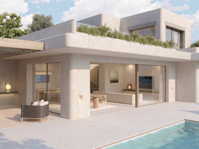 Vue extérieure d'une villa contemporaine avec piscine privée. La terrasse offre une pergola en bois, un salon extérieur et de larges baies vitrées vers l'intérieur décloisonné.