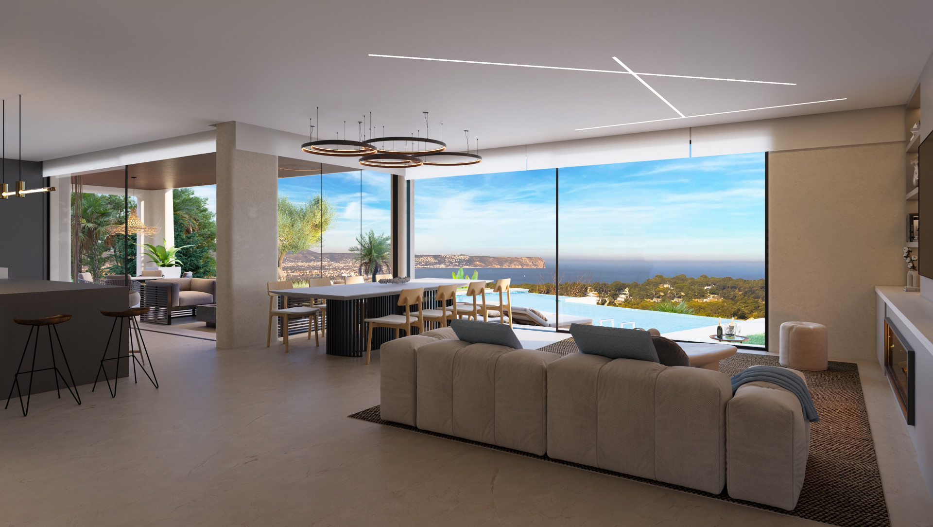 Salon spacieux avec vue panoramique sur la mer, cuisine ouverte et mobilier moderne à Jávea.