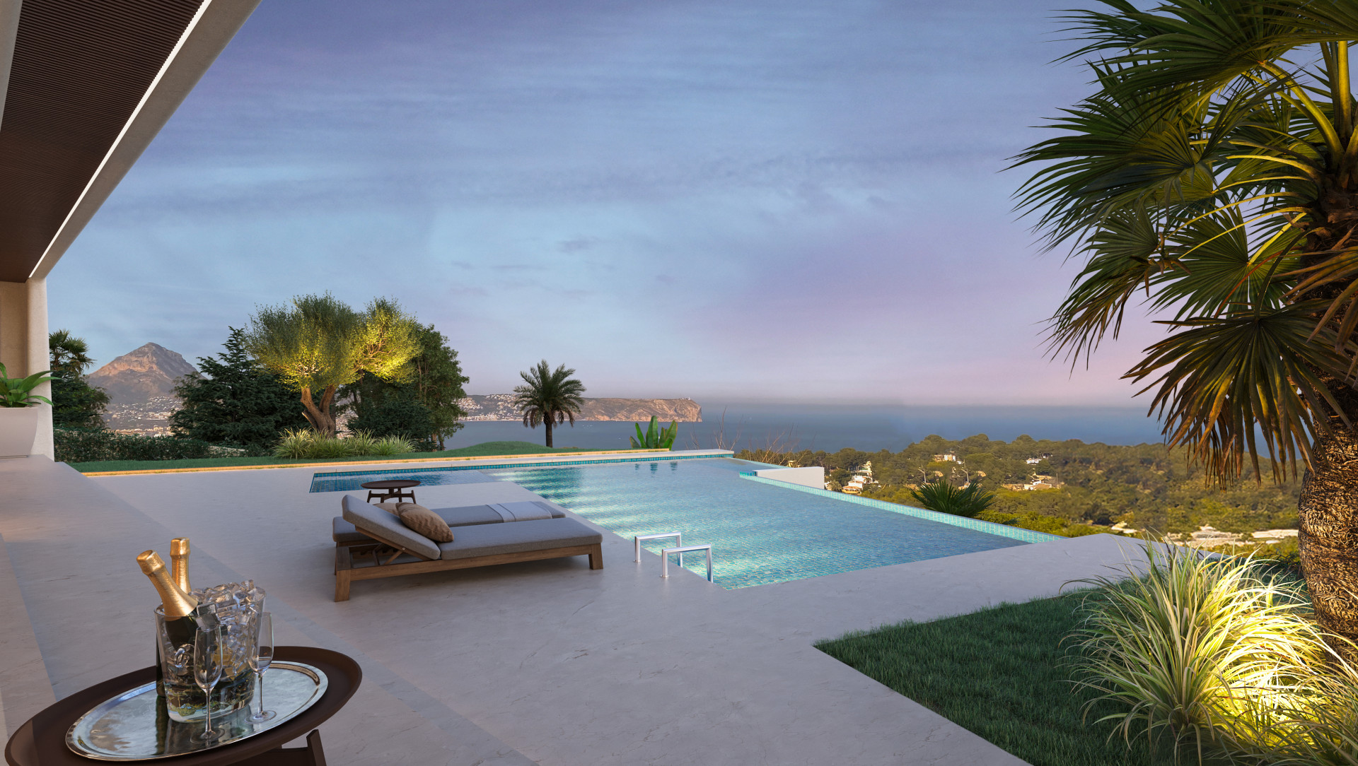 Vue sur la piscine à débordement avec transats, jardin et vues sur la mer et la montagne au coucher du soleil à Jávea.