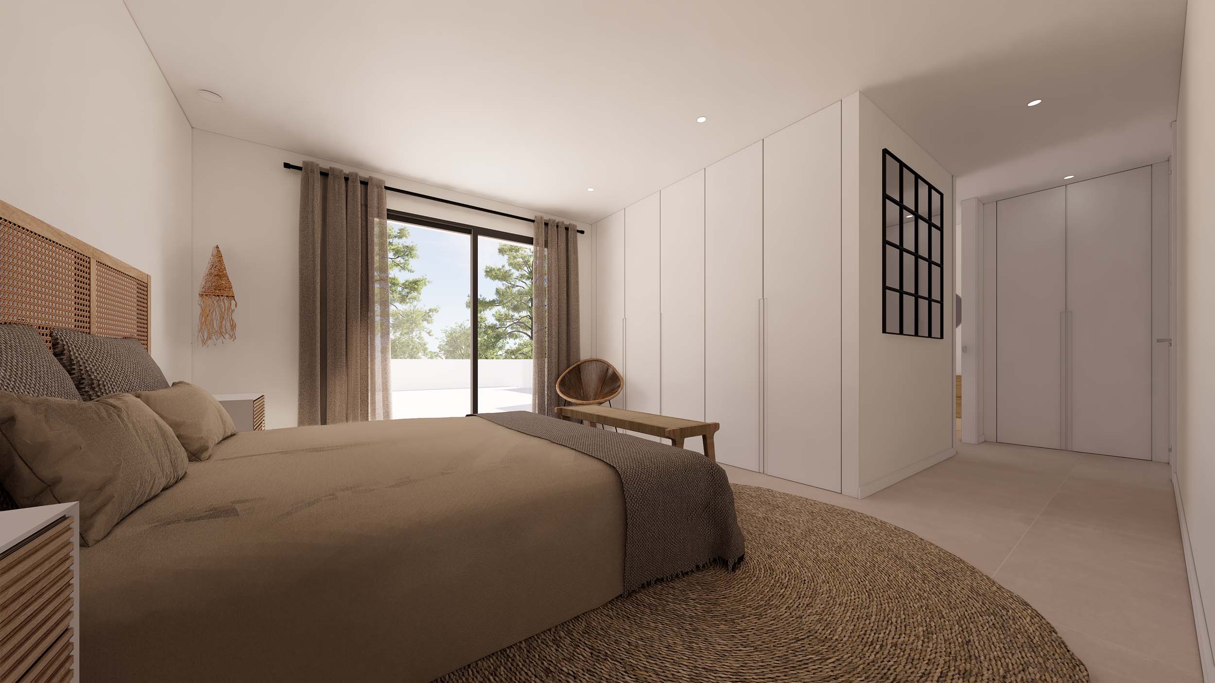 Chambre de style ibizien avec placards intégrés, tête de lit en rotin et accès direct à la terrasse par de grandes baies vitrées.